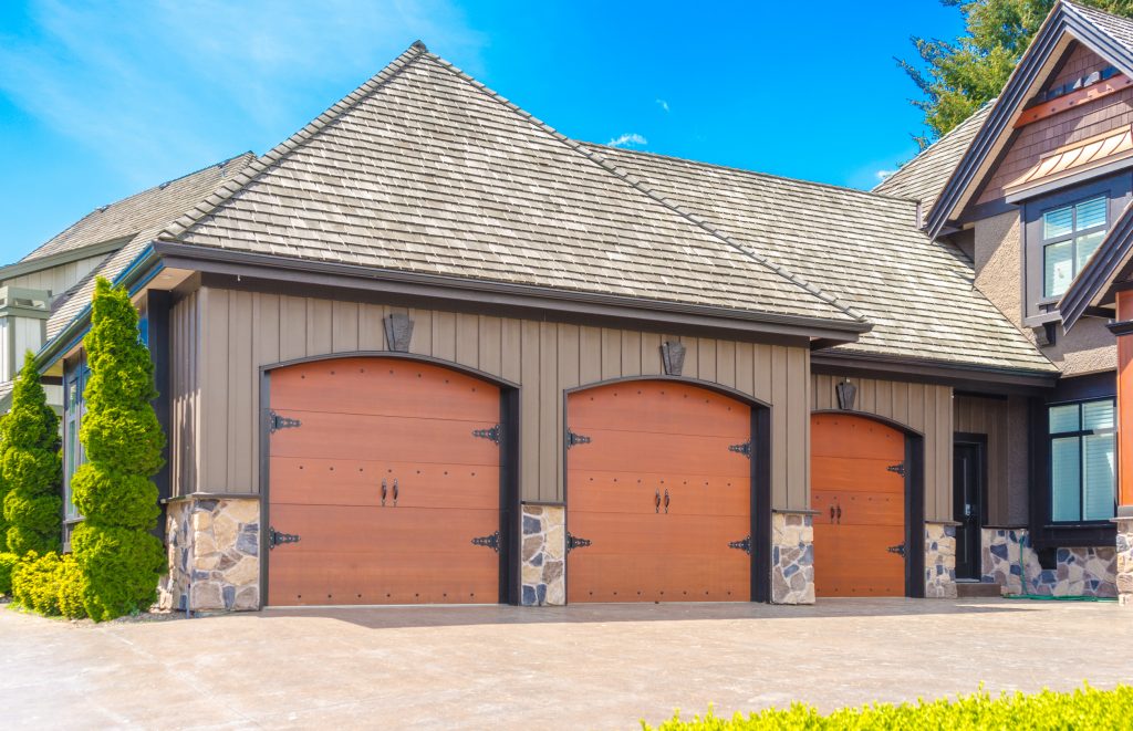 Triple doors garage with wide long driveway